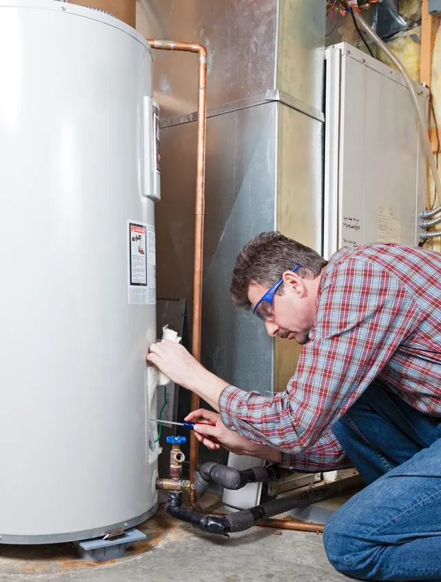 Technician working on water heater.