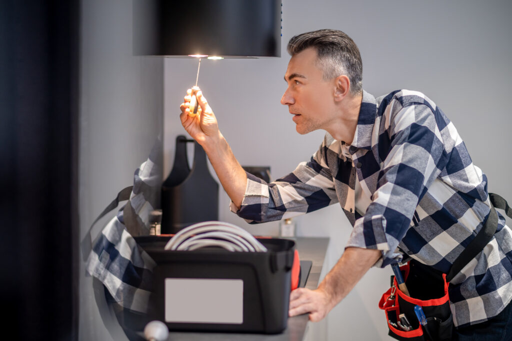a man working on lamp